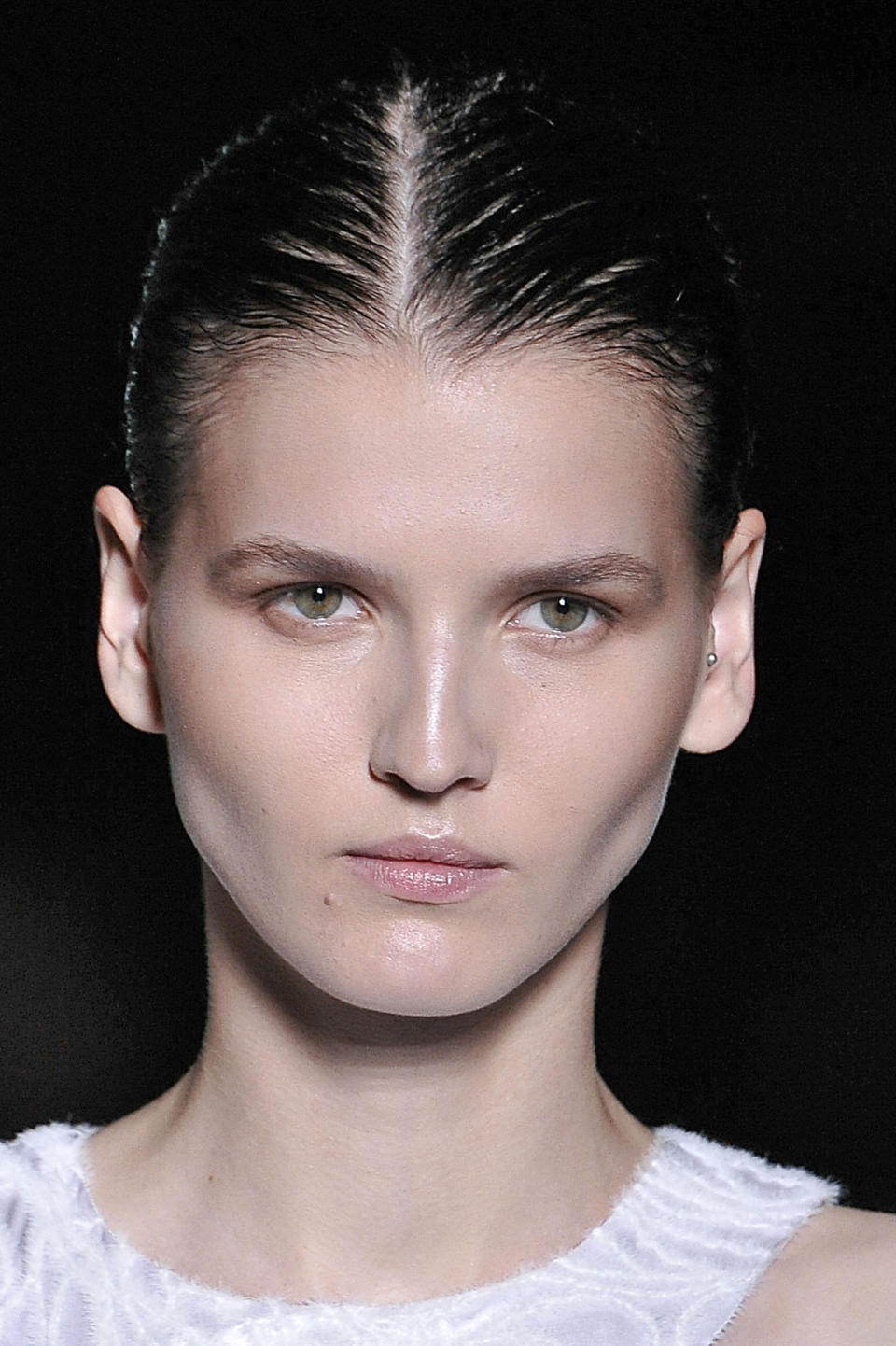 A “healthy sculpted face” was the look of the day, as Diane Kendal dusted sculpting powder on eyes, cheeks, and temples to create dimension. MAC’s loose Pigment ($21) in Vanilla highlighted the cheekbones and above the brows, capturing light as models swanned down the runway. 