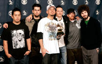 <p>The group Linkin Park poses with their award in the press room at the 48th Annual Grammy Awards at the Staples Center on February 8, 2006 in Los Angeles, California. (Photo: Kevin Winter/Getty Images) </p>