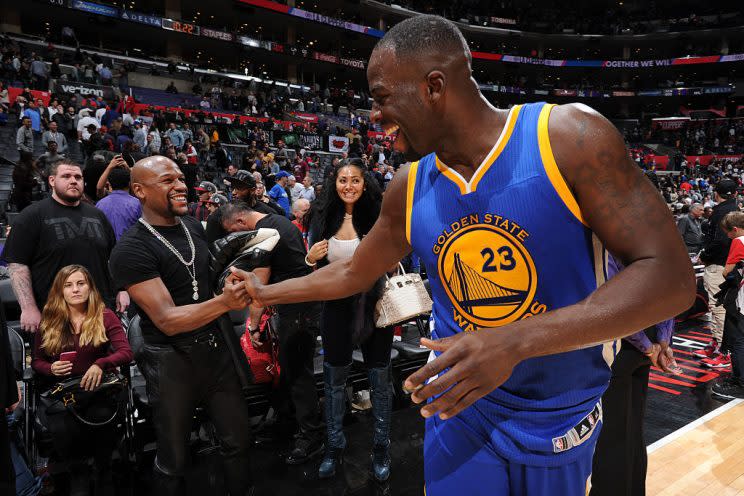 Draymond Green greets Floyd Mayweather at STAPLES Center after a Nov. 19, 2015, game. (Andrew D. Bernstein/NBAE/Getty Images)