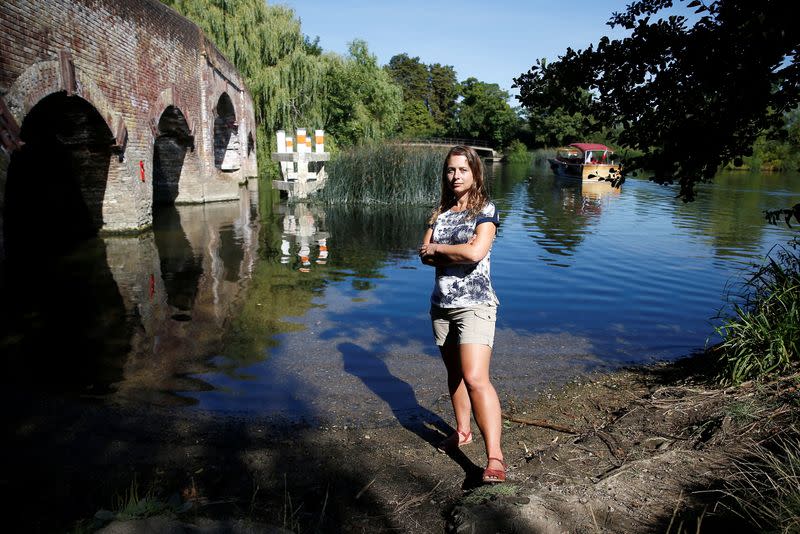 Climate scientist, Professor Hannah Cloke, poses for a photograph on the banks of the River Thames in Sonning