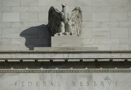 A detail from the front of the United States Federal Reserve Board building is shown in Washington October 28, 2014. REUTERS/Gary Cameron