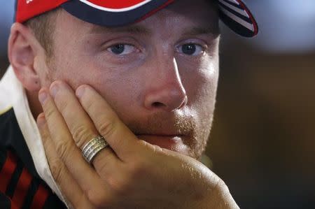 England cricketer Andrew Flintoff listens to questions during a news conference in central London, August 24, 2009. REUTERS/Andrew Winning