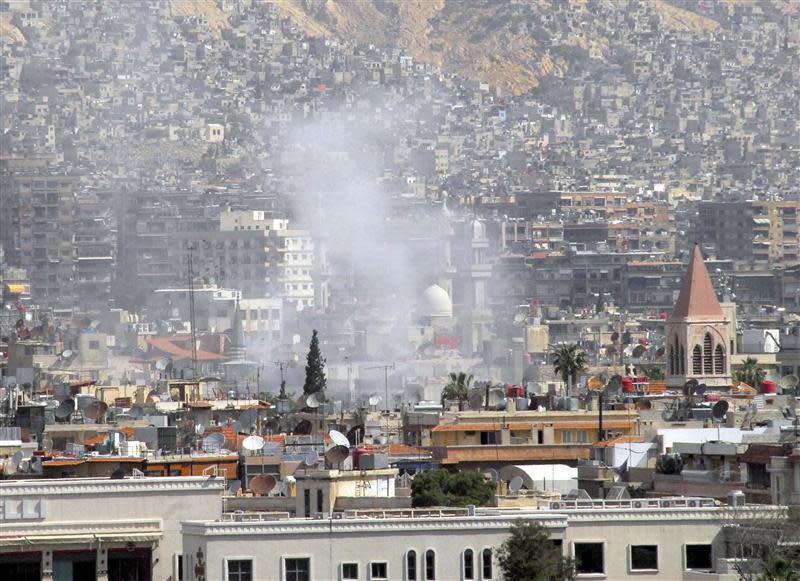 A view shows smoke rising after mortar bombs landed on a neighborhood in Damascus April 21, 2014, in this handout photograph released by Syria's national news agency SANA. REUTERS/SANA/Handout via Reuters