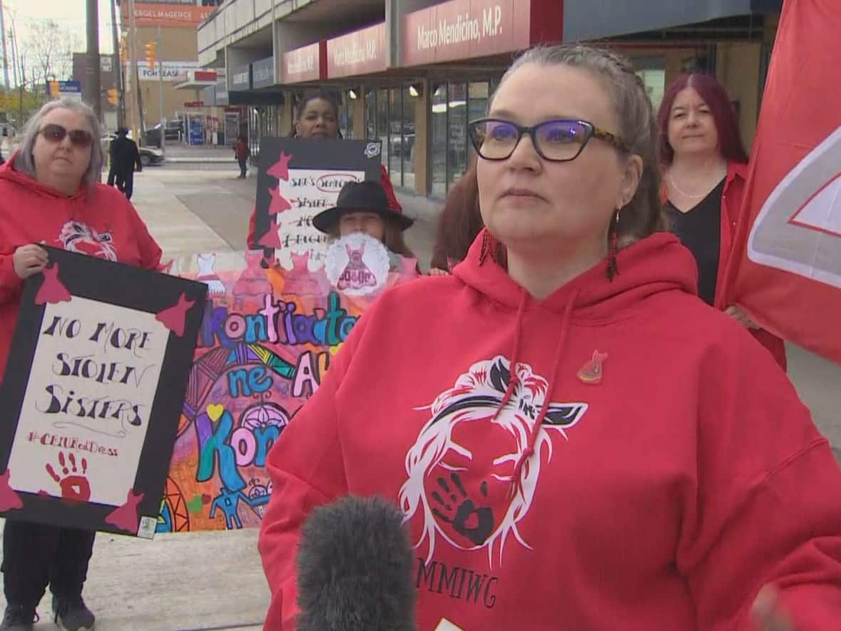 Corrina Gavan, right, took part in a Toronto rally outside the office of Minister of Public Safety Marco Mendicino on Friday that called for swift action to implement a Red Dress Alert system in order to 'de-normalize' Indigenous woman and children who go missing. (CBC - image credit)