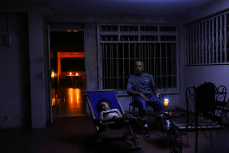 People rest at their house during a blackout in Puerto Ordaz, Venezuela, March 9, 2019. REUTERS/William Urdaneta