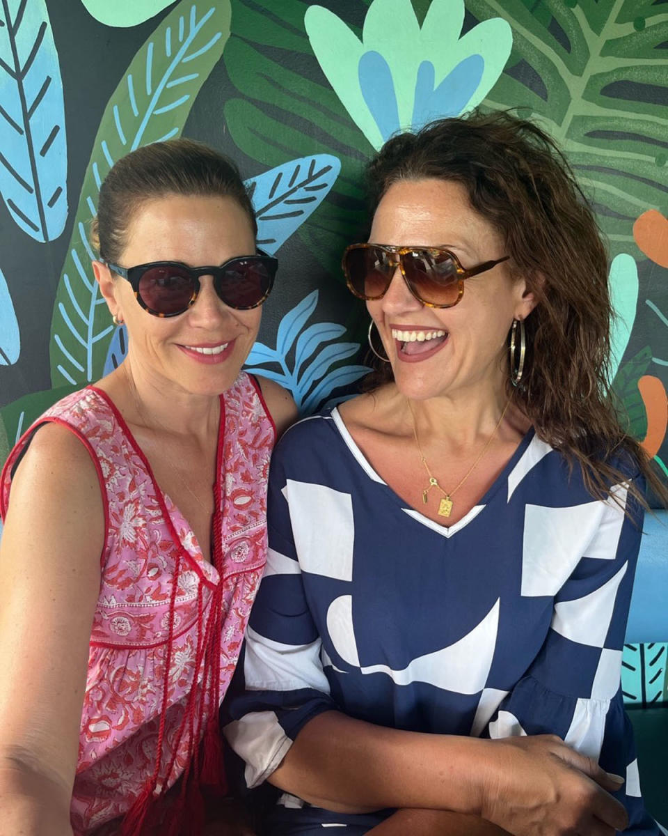 Jane Hall and Chrissie Swan wearing sunglasses and smiling in Bali