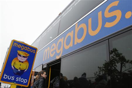 Passengers board a Megabus bus in New York City May 8, 2014. REUTERS/Eduardo Munoz