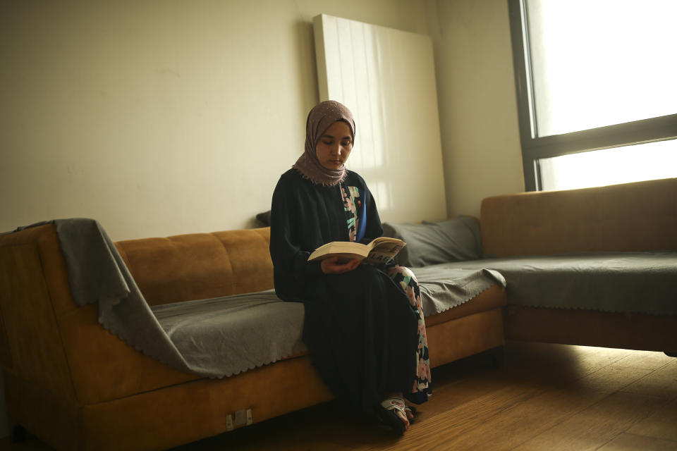 Uyghur Nursimangul Abdureshid, 34, poses for a photograph during an interview with The Associated Press in Istanbul, Turkey on May 4, 2022. Nearly one in 25 people in a county in the Uyghur heartland of China has been sentenced to prison on terrorism-related charges, in what is the highest known imprisonment rate in the world, an Associated Press review of leaked data shows. Abdureshid's brother, Memetali Abdureshid, who ran a car repair shop, was listed as being sentenced to 15 years and 11 months in prison on charges of "picking quarrels and provoking trouble” and “preparing to carry out terrorist activities." (AP Photo/Emrah Gurel)