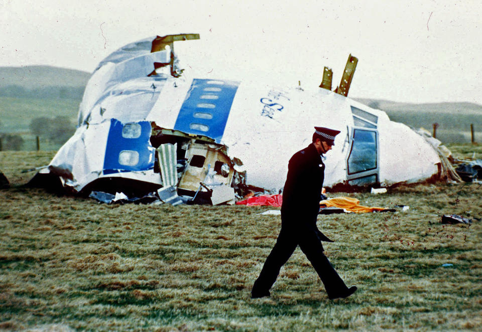 A police officer walks by the nose of Pan Am flight 103 in a field near the town of Lockerbie, Scotland (Martin Cleaver / AP file )