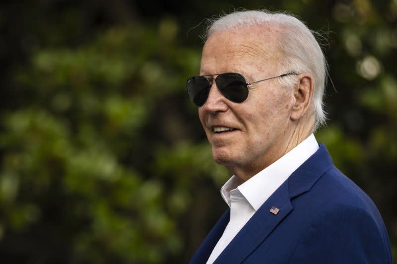 President Joe Biden looks towards reporters shouting questions as he walks towards the White House after landing in Marine One on Sunday, July 7, 2024 in Washington, DC. The President and First Lady are returning to the White House after campaign events in Philadelphia and Harrisburg, Pennsylvania. Interviewers in Milwaukee and Philadelphia said they were given questions prior to interviews. Photo by Samuel Corum/UPI