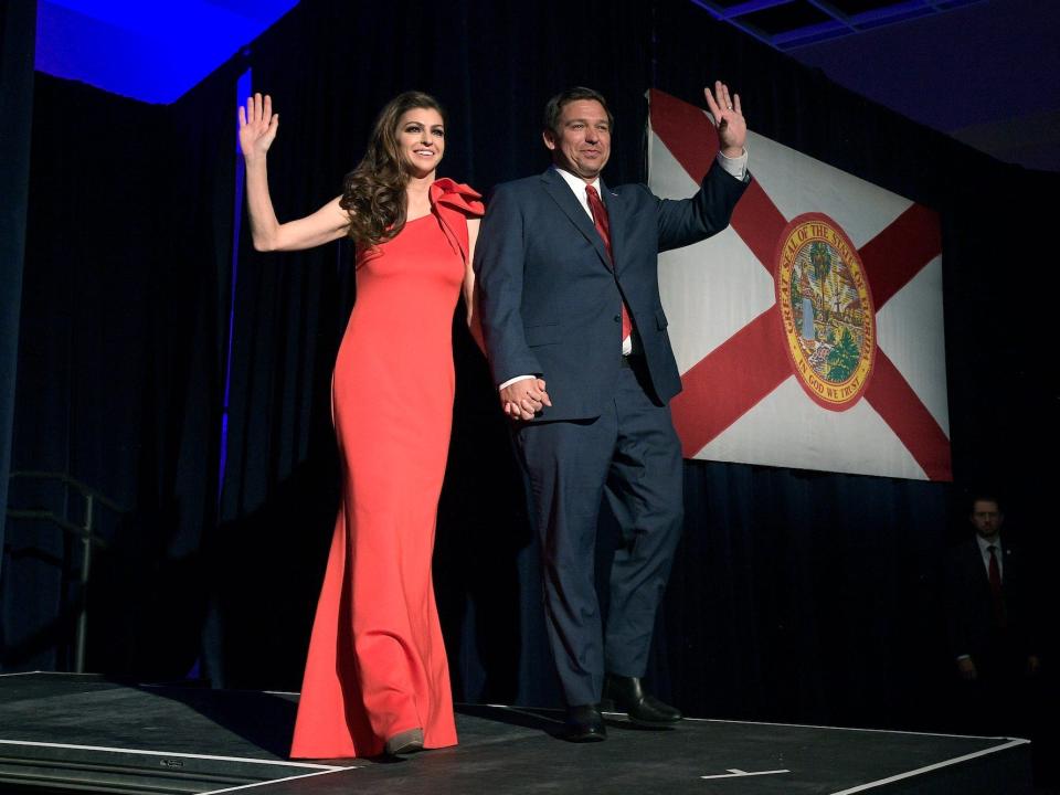 Then-Florida Gov.-elect Ron DeSantis, right, and his wife Casey wave to supporters as they walk onto the stage after he was declared the winner of the election at his party Tuesday, November 6, 2018, in Orlando, Florida.