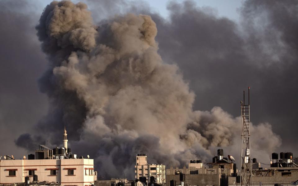 Smoke rises following Israeli air strikes in Khan Younis, southern Gaza Strip