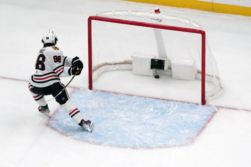 Chicago Blackhawks' Connor Bedard reacts after the Chicago Blackhawks gave up an empty-net goal to St. Louis Blues' Jordan Kyrou during the third period of an NHL hockey game Saturday, Dec. 23, 2023, in St. Louis. (AP Photo/Jeff Roberson)