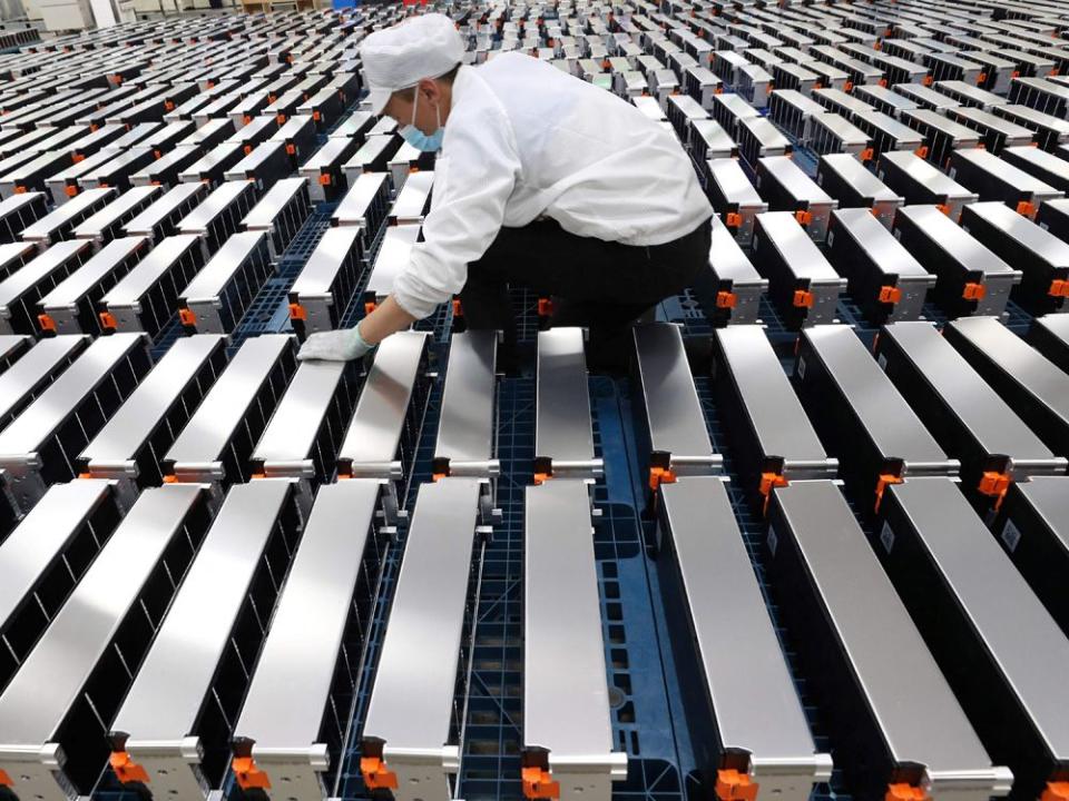  A worker with car batteries at a factory for Xinwangda Electric Vehicle Battery Co. Ltd, which makes lithium batteries for electric cars and other uses, in Nanjing in China’s eastern Jiangsu province.