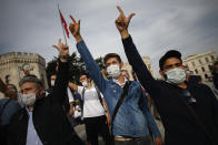 Demonstrators chant slogans during an anti-France protest in Istanbul, Sunday, Oct. 25, 2020. Turkish President Recep Tayyip Erdogan on Sunday challenged the United States to impose sanctions against his country while also launching a second attack on French President Emmanuel Macron. Speaking a day after he suggested Macron needed mental health treatment because of his attitude to Islam and Muslims, which prompted France to recall its ambassador to Ankara, Erdogan took aim at foreign critics. (AP Photo/Emrah Gurel)