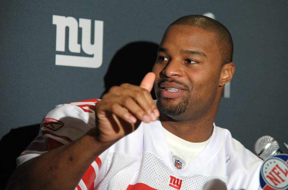 Feb 2, 2012; Indianapolis, IN, USA; New York Giants defensive end Osi Umenyiora during the press conference for Super Bowl XLVI against the New England Patriots at the Marriott Indianapolis Downtown. Mandatory Credit: Kirby Lee/Image of Sport-USA TODAY Sports