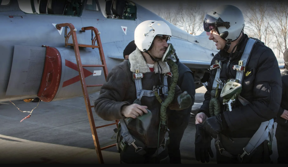 An image from the TFASA website apparently showing Western aircrew in front of a Chinese FTC-2000 jet trainer. <em>TFASA</em>