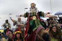 <p>A man dressed as one of the Three Kings greets people during the Epiphany parade in Gijon, Spain, Jan. 5, 2018. (Photo: Eloy Alonso/Reuters) </p>