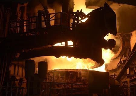 The top of a steel pan is pictured beside a furnace at the plant of German steel company Arcelor Mittal in Hamburg on March 25, 2013. REUTERS/Fabian Bimmer