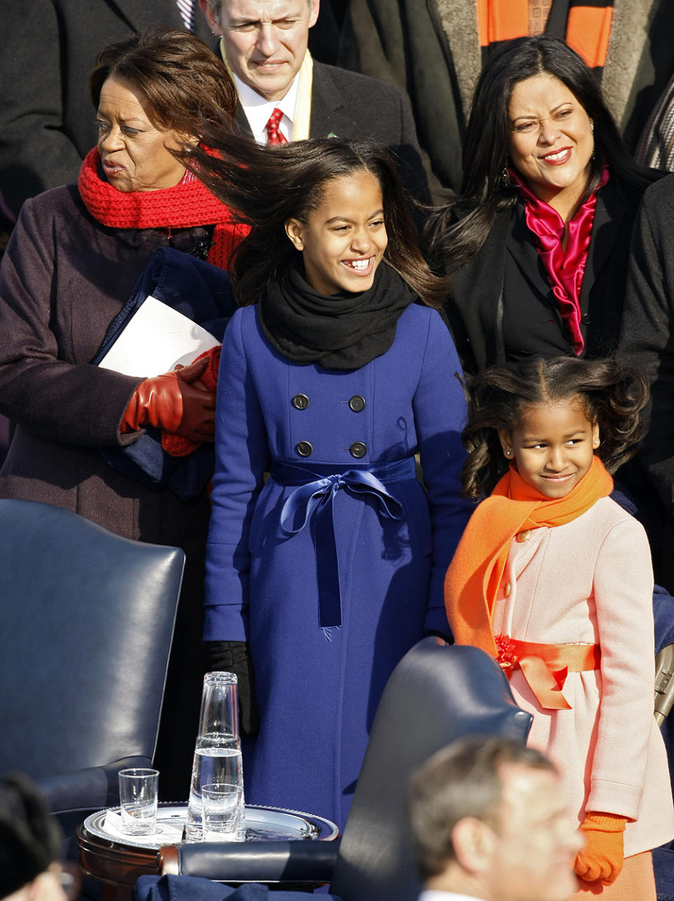 Malia and Sasha in brightly-colored J.Crew coats. (Photo: Getty Images)