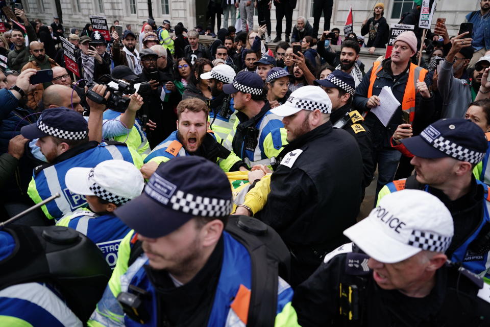 Police Officers clash with rival supporters as protesters walk past the Cenotaph on Whitehall during a pro-Palestine march organised by Palestine Solidarity Campaign in central London. Picture date: Saturday October 28, 2023. (Photo by Jordan Pettitt/PA Images via Getty Images)