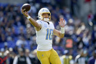 Los Angeles Chargers quarterback Justin Herbert throws a pass against the Baltimore Ravens during the first half of an NFL football game, Sunday, Oct. 17, 2021, in Baltimore. (AP Photo/Gail Burton)