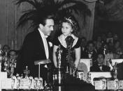 <p>Walt Disney, accompanied by presenter Shirley Temple, won an honorary Oscar trophy, which was accompanied by seven other smaller statuettes representing Snow White's dwarves from the classic animated film.</p>