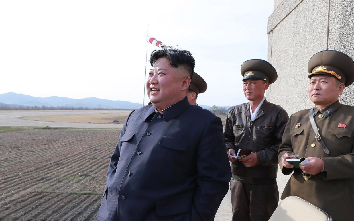 North Korean leader Kim Jong-Un observing the flight drill of the combat pilots of Unit 1017, 16 April  - AFP