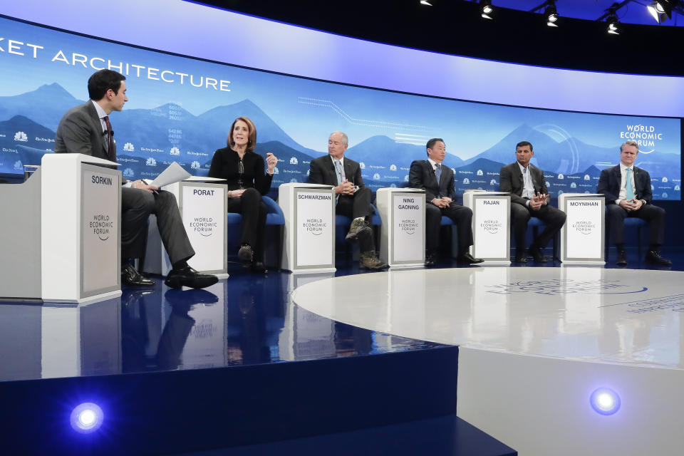 From left, moderator Andrew R. Sorkin, Senior Vice-President and Chief Financial Officer of Google Ruth Porat, Stephen A. Schwarzman, CEO of Blackstone, Ning Gaoning, Chairman Sinochem Group, Raghuram G. Rajan of the University of Chicago and Brian T. Moynihan, CEO Bank of America, discuss during the session 'Shaping a New Market Architecture' at annual meeting of the World Economic Forum in Davos, Switzerland, Tuesday, Jan. 22, 2019. (AP Photo/Markus Schreiber)