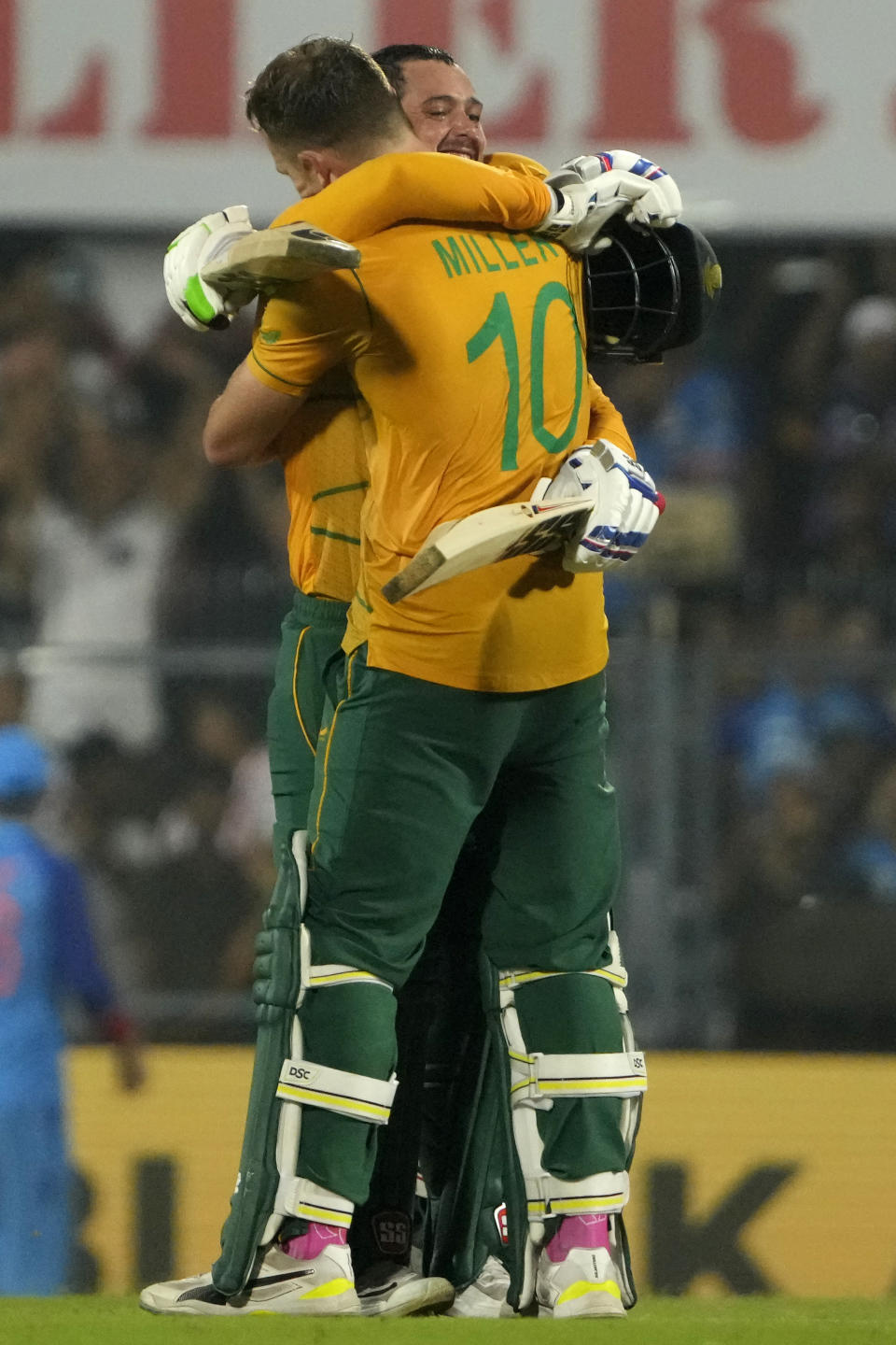 South Africa's David Miller, right, celebrates with batting partner Quinton de Kock after scoring a century during the second T20 cricket match between India and South Africa, in Guwahati, India, Sunday, Oct. 2, 2022. (AP Photo/Anupam Nath)