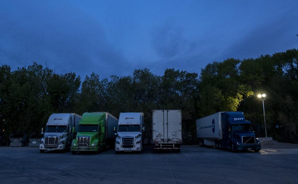 Truckers park for the night at the Sinclair gas station in Alamo, NV.