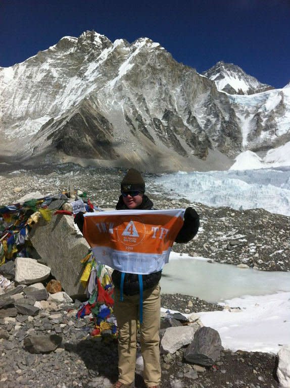 US teenager Eli Reimer poses at Everest Base Camp in the shadow of Mount Everest, April 3, 2013. Reimer, who suffers from Down's Syndrome, reached the 5,364-metres (17,500 foot) high camp in Nepal's Himalayan mountains in mid-March after 10 days of trekking