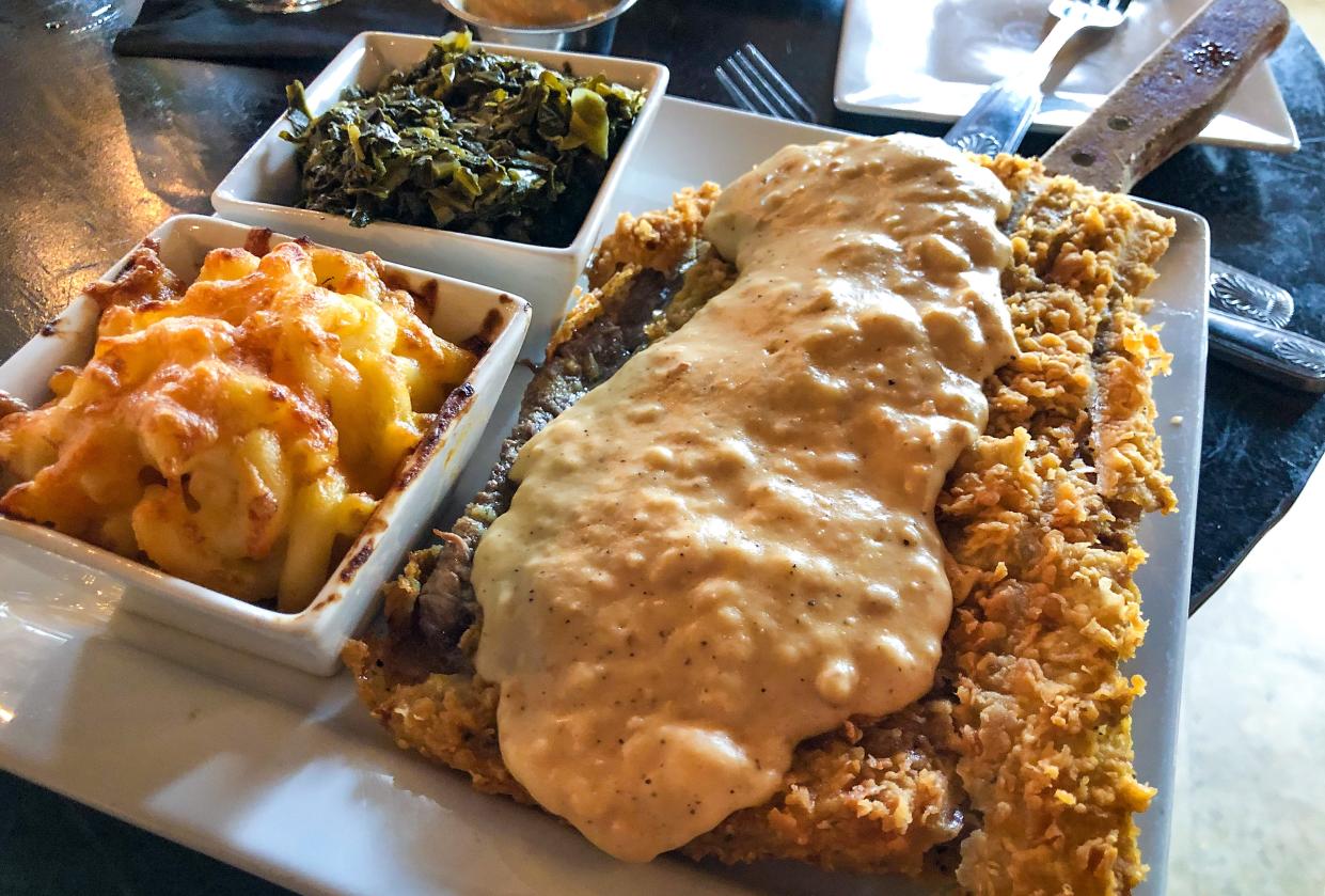 Country Fried Steak, Angus beef, house blend seasonings, country white gravy for $12.95 at Fancy's Southern Cafe in Fort Myers.The picture was shot for National Southern Food Day that is celebrated all around the United States on January 22nd each year.