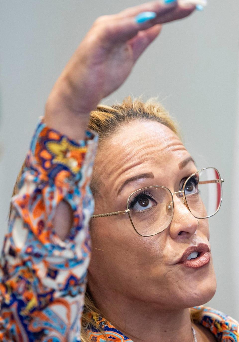 Gloria Hampton explains where she sat in the RV the day she witnessed her father kill her mother during a press conference in the hopes of finding her father, who allegedly killed her mother in front of her and potentially her sister, on Tuesday, April 30, 2024, at Miami-Dade Police Department Headquarters in Doral. Hampton’s mother, Nilsa Padilla, was murdered and dismembered in 1985.