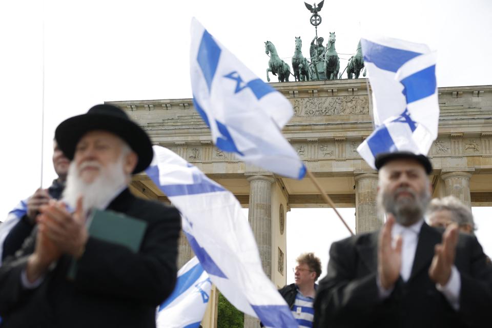 People gather in front of the Brandenburg gate in Berlin on April 14, 2024 in solidarity with Israel after Iran's strikes on Israel from late April 13, 2024. Countries around the world condemned Iran's strikes on Israel late April 13, 2024, warning the attack threatened to further destabilise the Middle East.