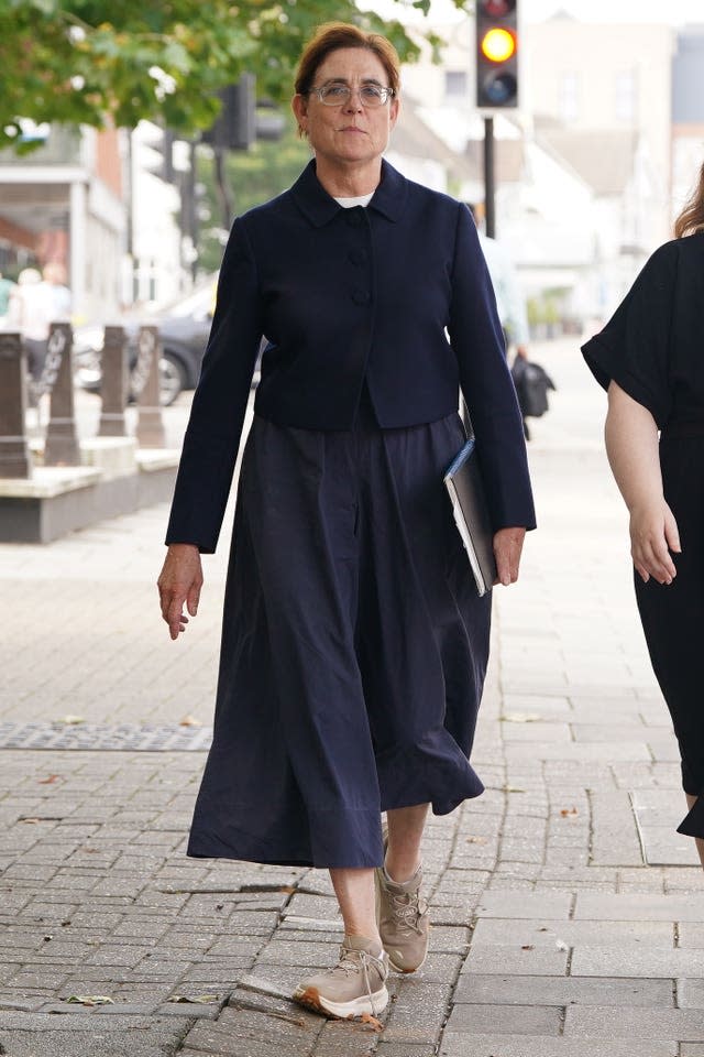 Baroness Kate Lampard walking along a street