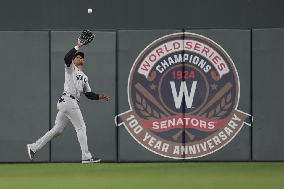 New York Yankees right fielder Juan Soto catches a fly out hit by Minnesota Twins' Jose Miranda during the eighth inning of a baseball game Tuesday, May 14, 2024, in Minneapolis. (AP Photo/Abbie Parr)