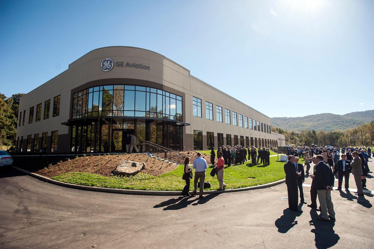 GE employees, dignitaries, politicians and more mingle at the grand opening outside GE Aviation's new plant in South Asheville, Wednesday, Oct. 15, 2014. The new plant is the only facility in the U.S. that will be mass-producing jet-engine components using a ceramic matrix composite invented by GE Aviation researchers. 10/15/14