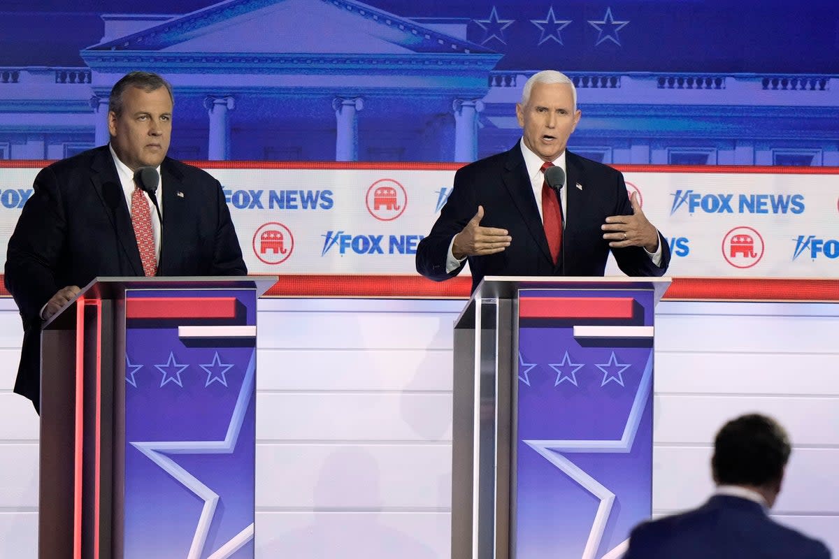 Former Vice President Mike Pence speaks as former New Jersey Gov. Chris Christie listens during a Republican presidential primary debate hosted by FOX News Channel Wednesday, Aug. 23, 2023, in Milwaukee. (Copyright 2023 The Associated Press. All rights reserved.)