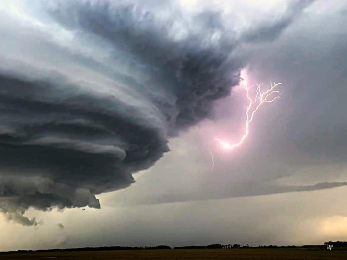 Large wall cloud with lightning spotted near Gerald, Sask. (Submitted by Janina Kemp - image credit)