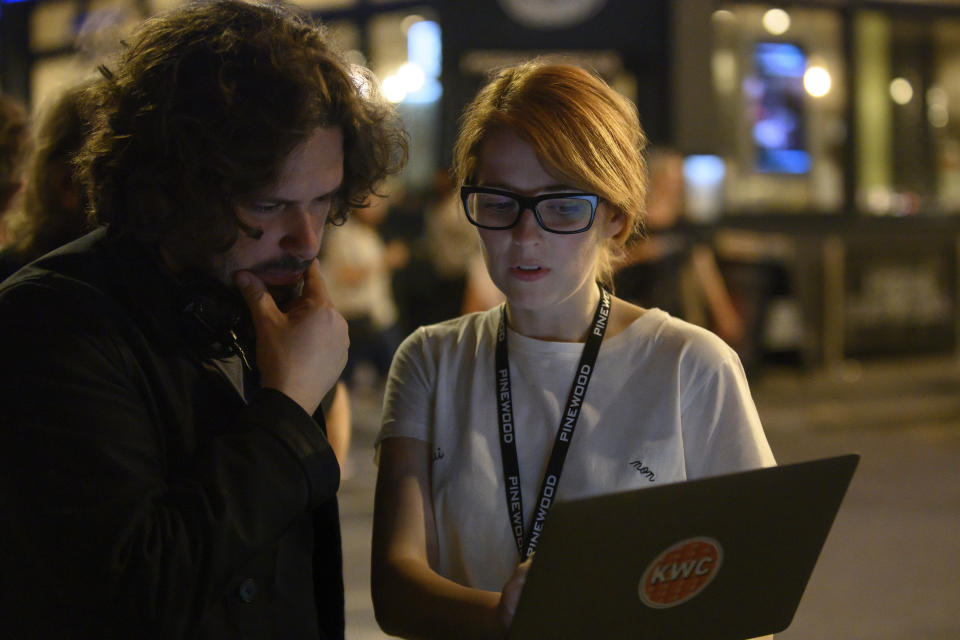 This image released by Focus Features shows director Edgar Wright, left, and writer Krysty Wilson-Cairns on the set of their film "Last Night in Soho." (Parisa Taghizadeh/Focus Features via AP)