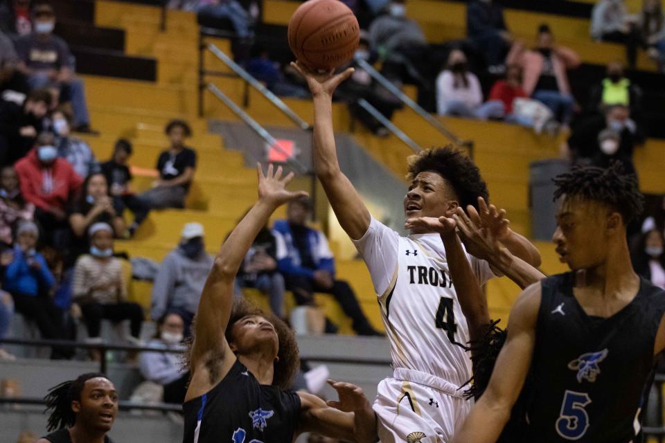 Topeka High sophomore Mister Cameron shoots the ball against Junction City earlier this season. Cameron is one of the young players looking to turn the program around.