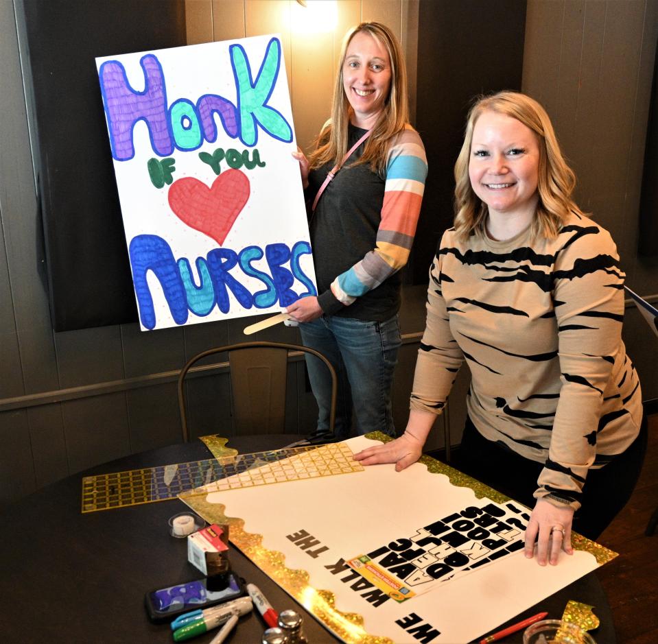 RNs Amy Stanton and Tara Coates work on pickets signs in preparation if BCINA does go on strike.