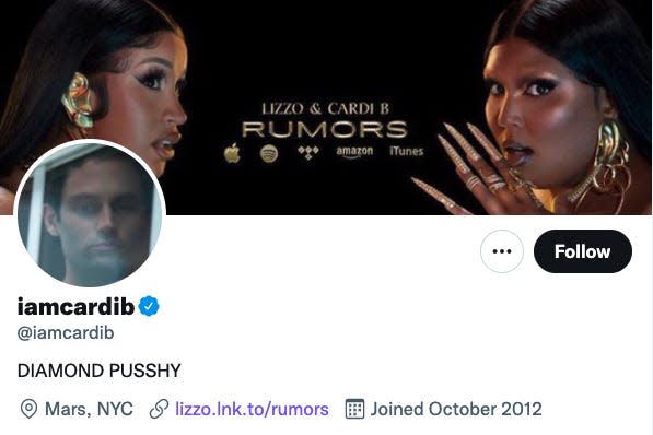 an image of cardi b's twitter profile, which features an image of penn badgley looking forlornly out a window as its profile picture