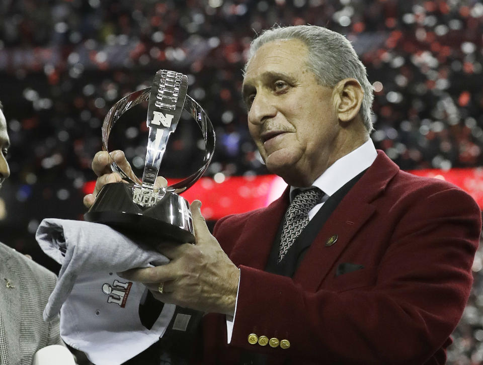 Atlanta Falcons owner look at the George Halas Trophy after the NFL football NFC championship game against the Green Bay Packers, Sunday, Jan. 22, 2017, in Atlanta. The Falcons won 44-21 to advance to Super Bowl LI. (AP Photo/David J. Phillip)