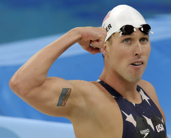 FILE - In this Tuesday, Aug. 12, 2008 file photo, United States' relay swimmer Klete Keller reacts after a men's 4x200-meter freestyle relay heat during the swimming competitions in the National Aquatics Center at the Beijing 2008 Olympics in Beijing. Five-time Olympic swimming medalist Klete Keller was charged Wednesday, Jan. 13, 2021 with participating in a deadly riot at the U.S. Capitol after video emerged that appeared to show him among those storming the building last week. (AP Photo/Thomas Kienzle, File)