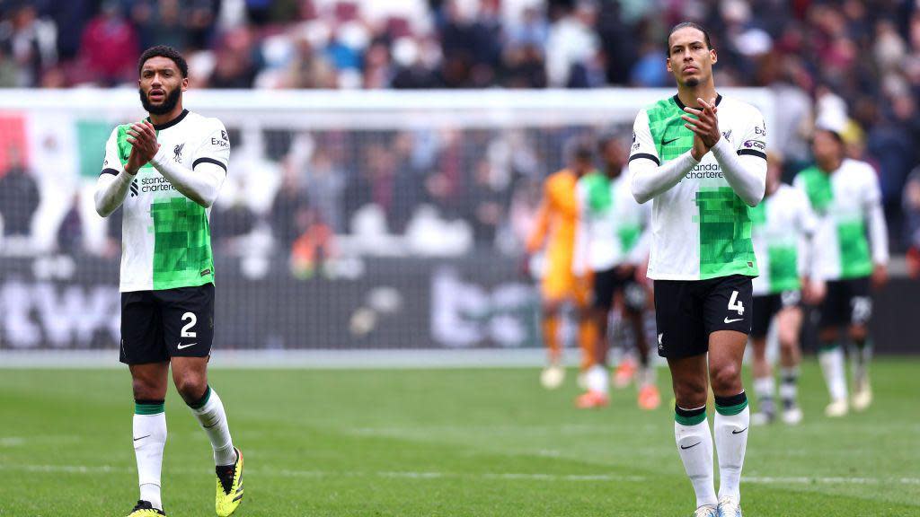 Joe Gomez and Virgil Van Dijk of Liverpool applaud the fans after the Premier League match between West Ham United and Liverpool FC at London Stadium