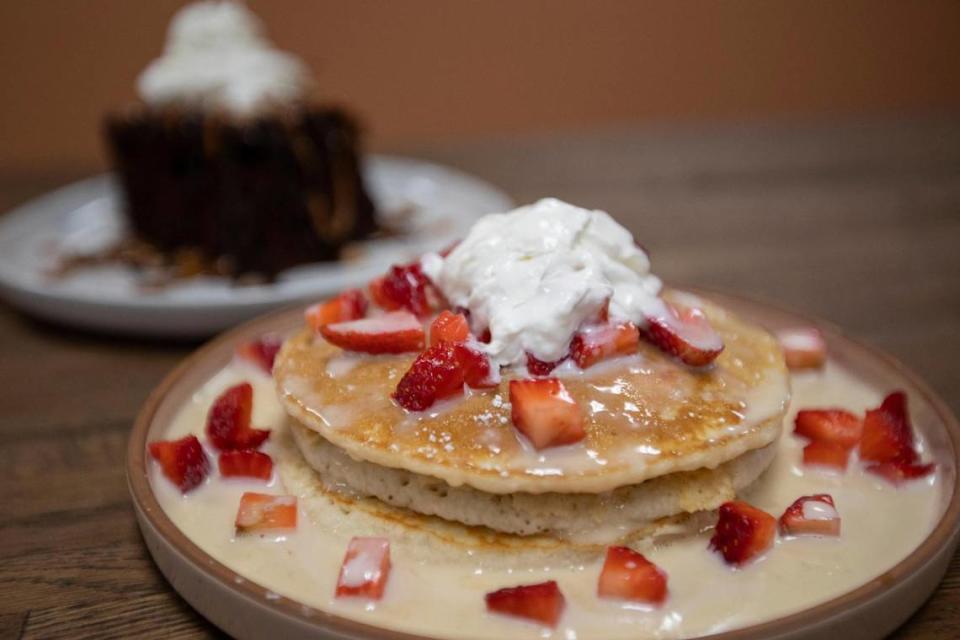 Tres leches pancakes from new restaurant La Dona are soaked in sweetened condensed milk, evaporated milk and heavy whipping cream, and then topped with cinnamon, whipped cream, and dulce de leche or caramel drizzle.