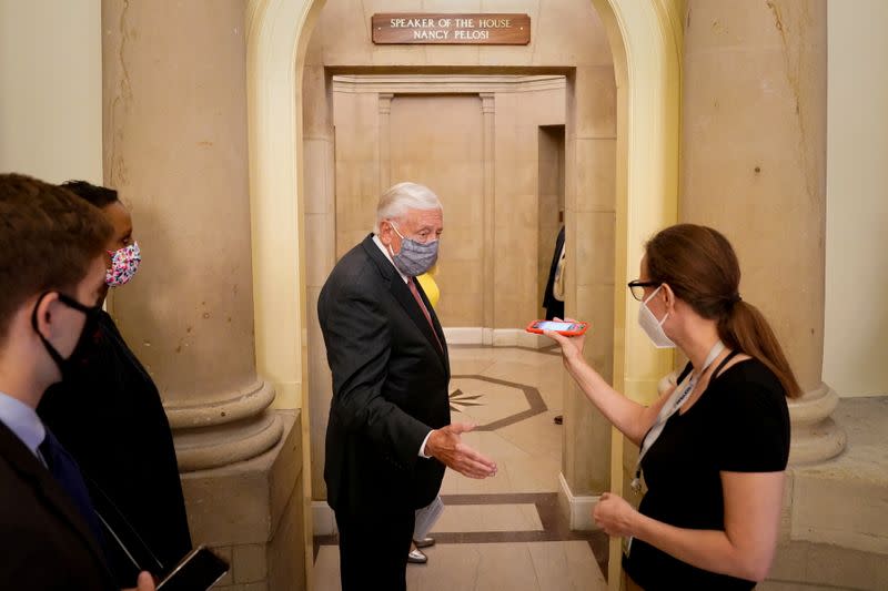 FILE PHOTO: House Majority Leader Steny Hoyer speaks to reporters outside Speaker of the House Nancy Pelosi's office in the U.S. Capitol in Washington