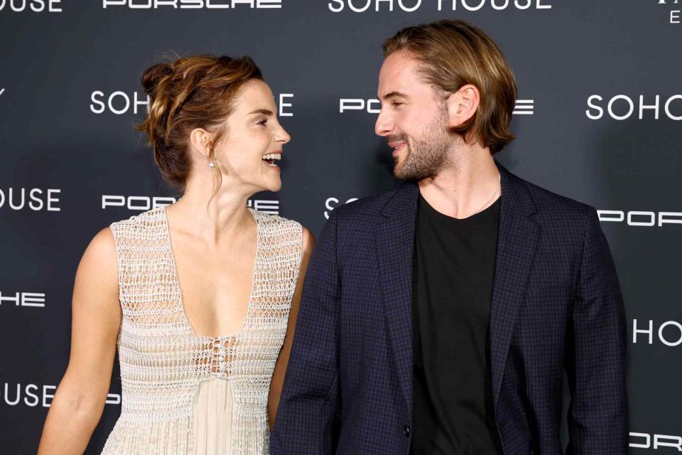 <p>Arturo Holmes/Getty</p> Emma Watson and Alex Watson on the 2nd Annual Soho House Awards’ Red Carpet